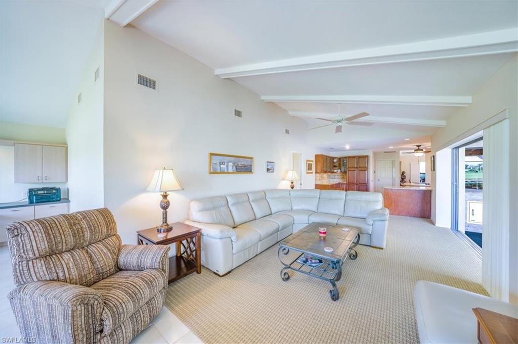 1101 Foxfire Lane Naples, FL 34104 - Photo 15 of 38 a living room with furniture and a couch