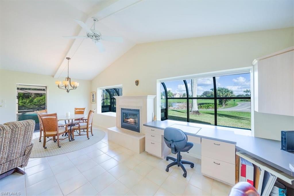 1101 Foxfire Lane Naples, FL 34104 - Photo 21 of 38 a view of a livingroom with workspace and a window