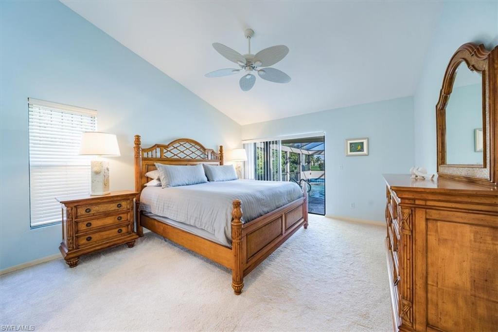 1101 Foxfire Lane Naples, FL 34104 - Photo 23 of 38 a bedroom with a bed and a dresser