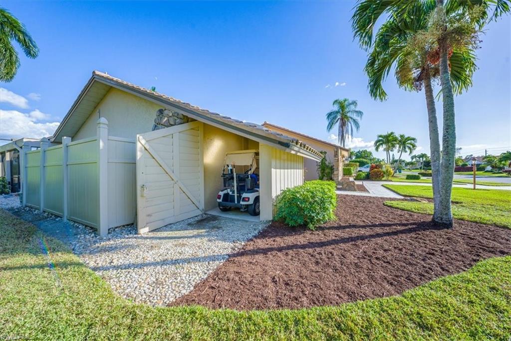 1101 Foxfire Lane Naples, FL 34104 - Photo 29 of 38 a view of a house with backyard and garden