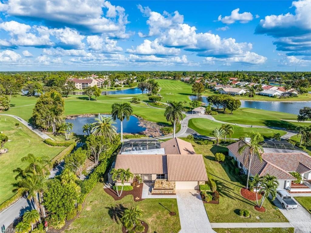 1101 Foxfire Lane Naples, FL 34104 - Photo 30 of 38 a view of a swimming pool with a patio