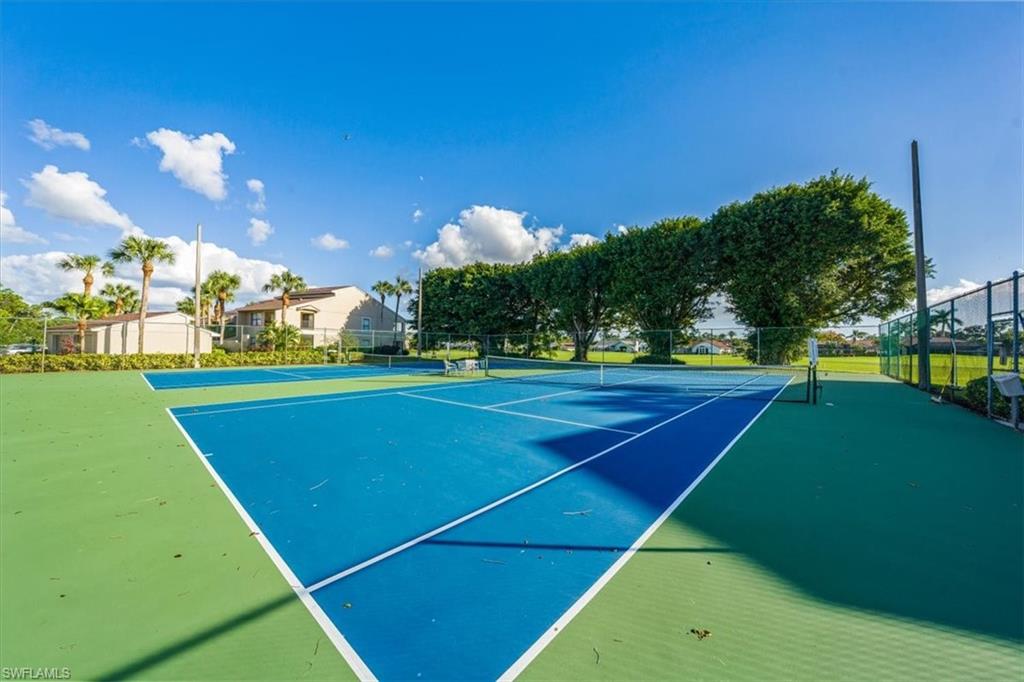 1101 Foxfire Lane Naples, FL 34104 - Photo 35 of 38 a view of a tennis court