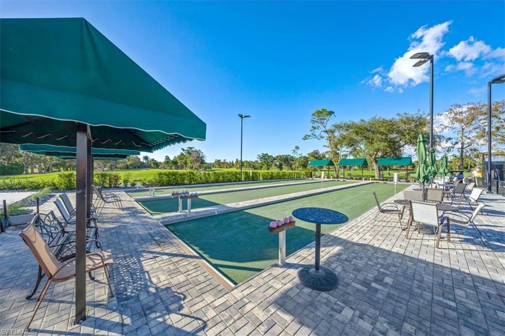 1101 Foxfire Lane Naples, FL 34104 - Photo 38 of 38 a view of a swimming pool with a patio