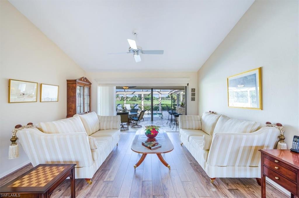 1101 Foxfire Lane Naples, FL 34104 - Photo 5 of 38 a living room with furniture and a large window
