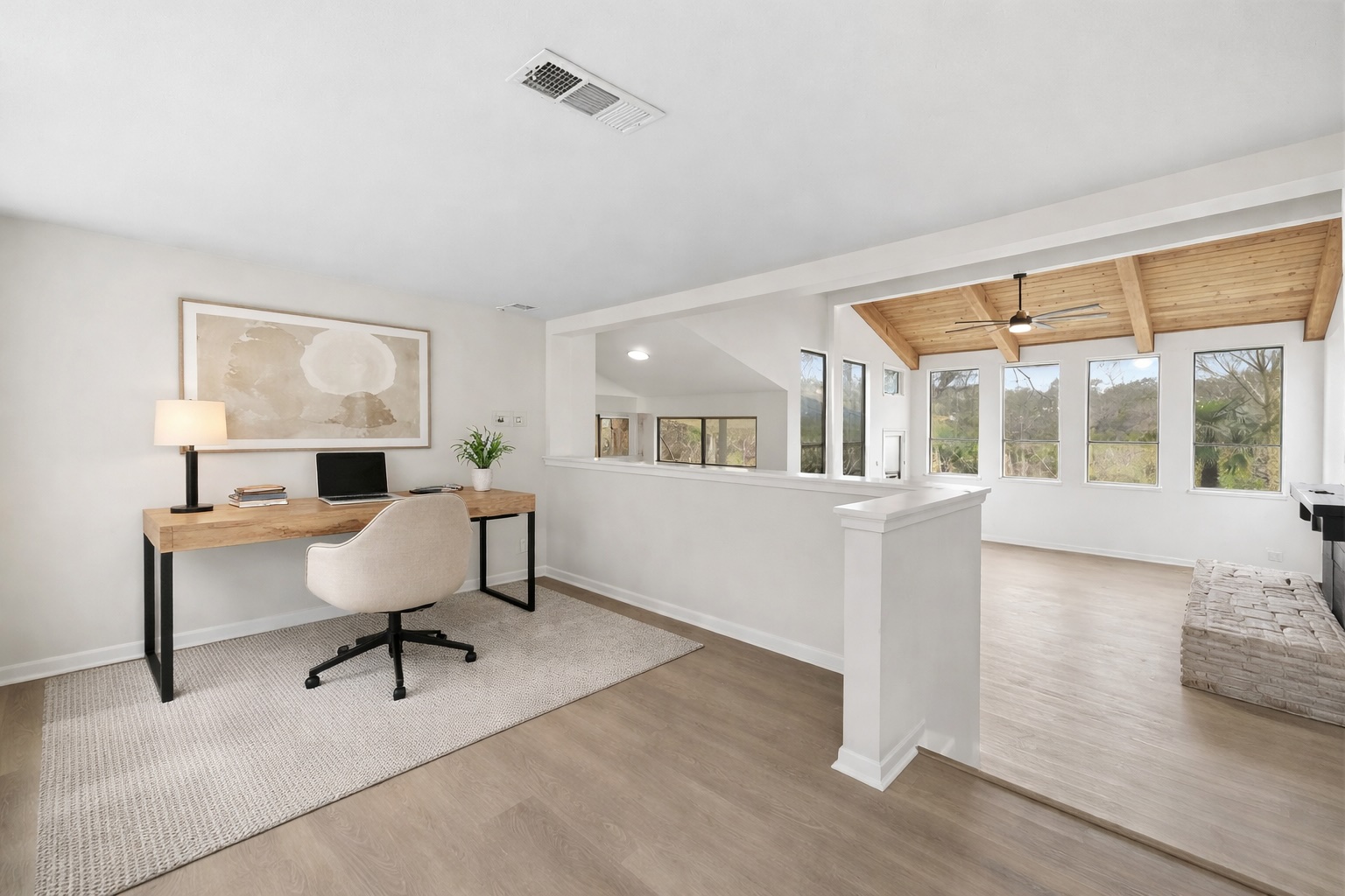 2204 Toro Canyon Road Austin, TX 78746 - Photo 13 of 26 Office area featuring vaulted ceiling with beams, light wood finished floors, ceiling fan, wooden ceiling, and a wood stove