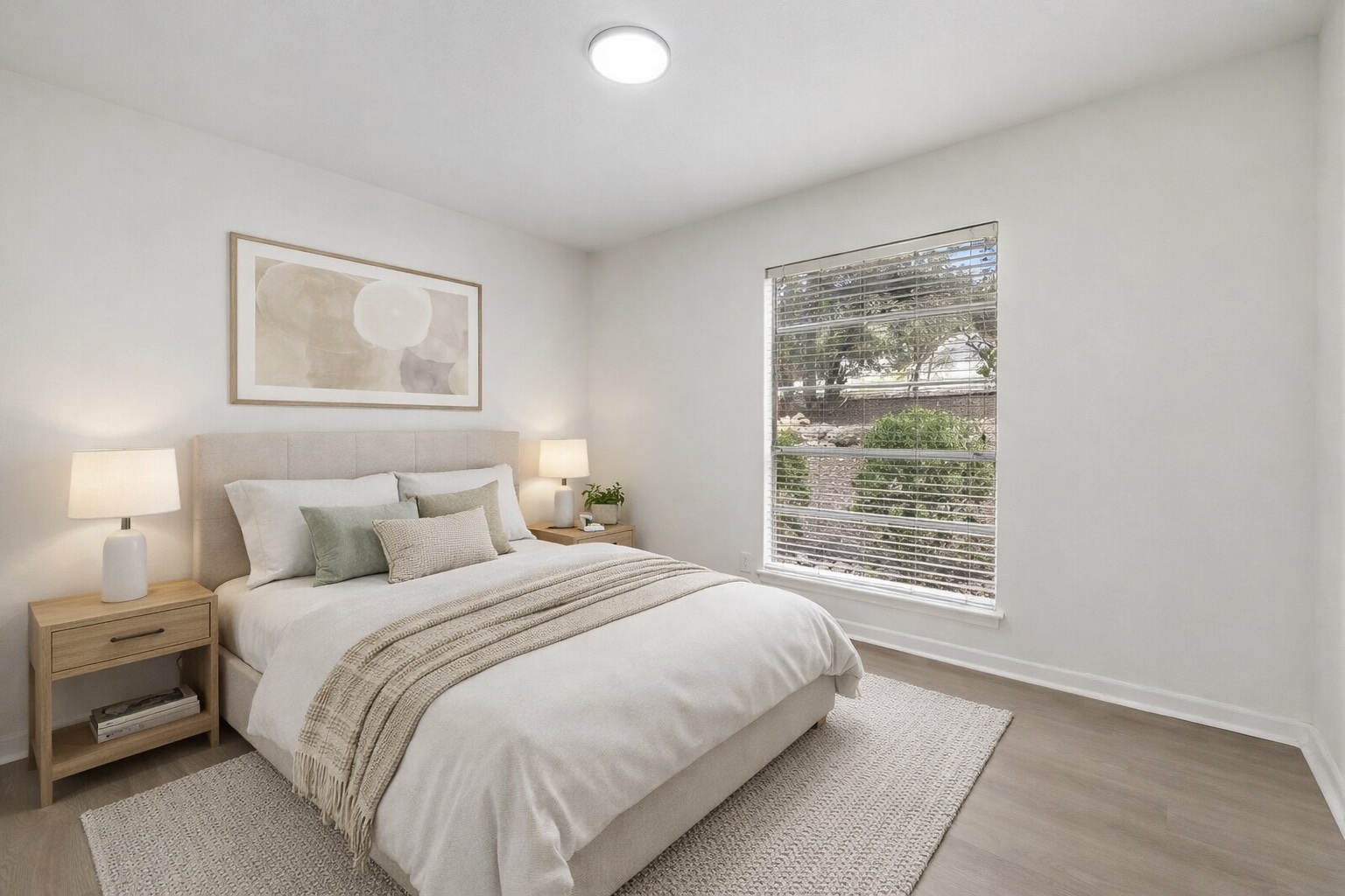 2204 Toro Canyon Road Austin, TX 78746 - Photo 16 of 26 Bedroom featuring baseboards and light wood-style floors
