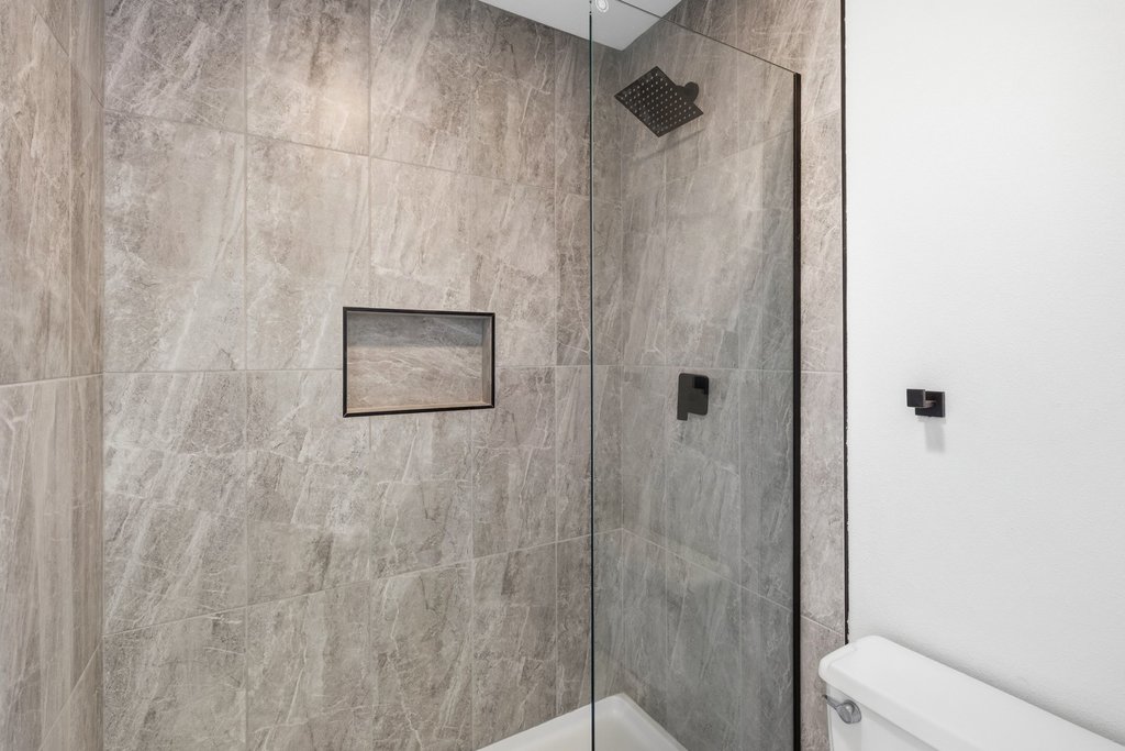 2204 Toro Canyon Road Austin, TX 78746 - Photo 20 of 26 Bathroom featuring toilet and walk in shower