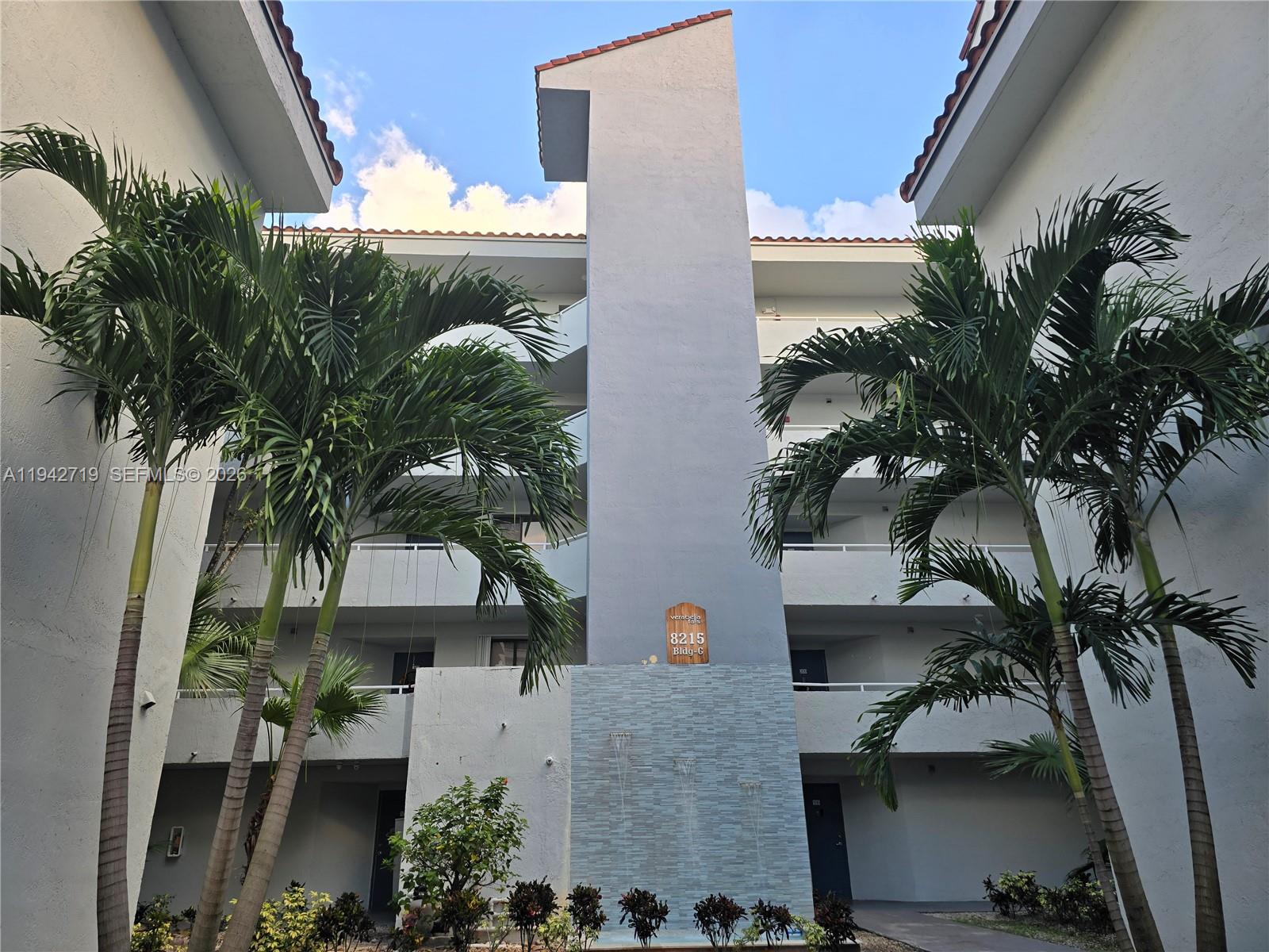 an aerial view of a house with a yard and garage