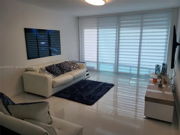 a living room with furniture and a window