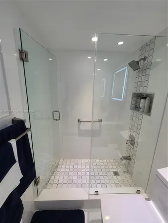a bathroom with a sink and a shower