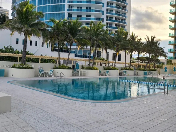 a view of ocean with palm trees
