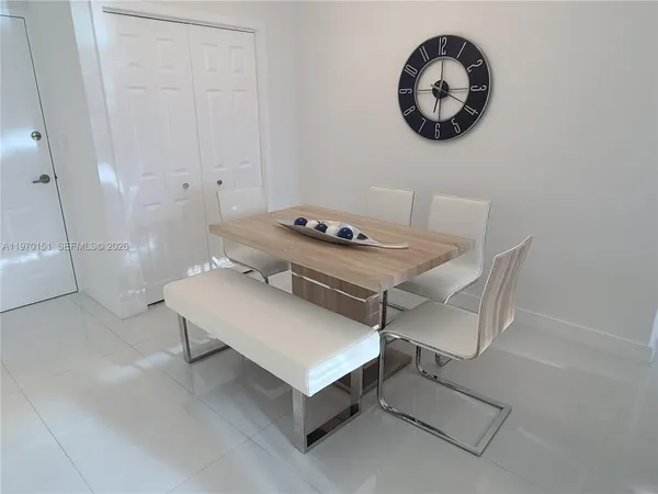 a room with a table and chairs