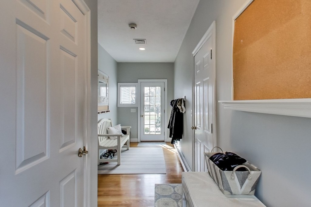 8 Rose Hill Road Hanover, MA 02339 - Photo 13 of 29 a hallway with a couch and a large window