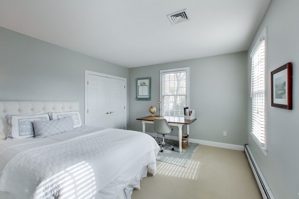 8 Rose Hill Road Hanover, MA 02339 - Photo 18 of 29 a bedroom with a bed and a table in it