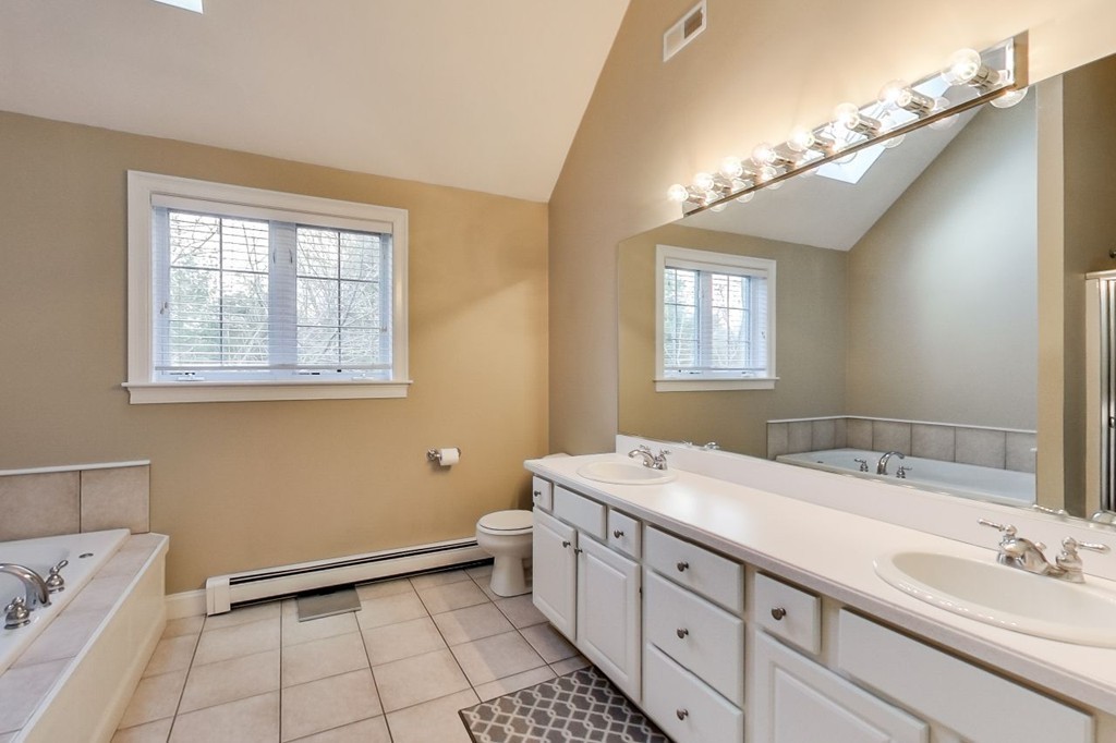 8 Rose Hill Road Hanover, MA 02339 - Photo 23 of 29 a bathroom with a sink a vanity and a mirror