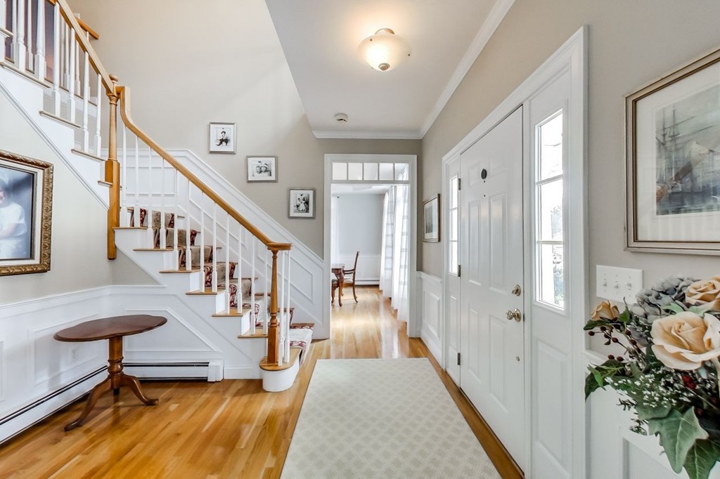 8 Rose Hill Road Hanover, MA 02339 - Photo 3 of 29 a view of a hallway with couches and a chandelier