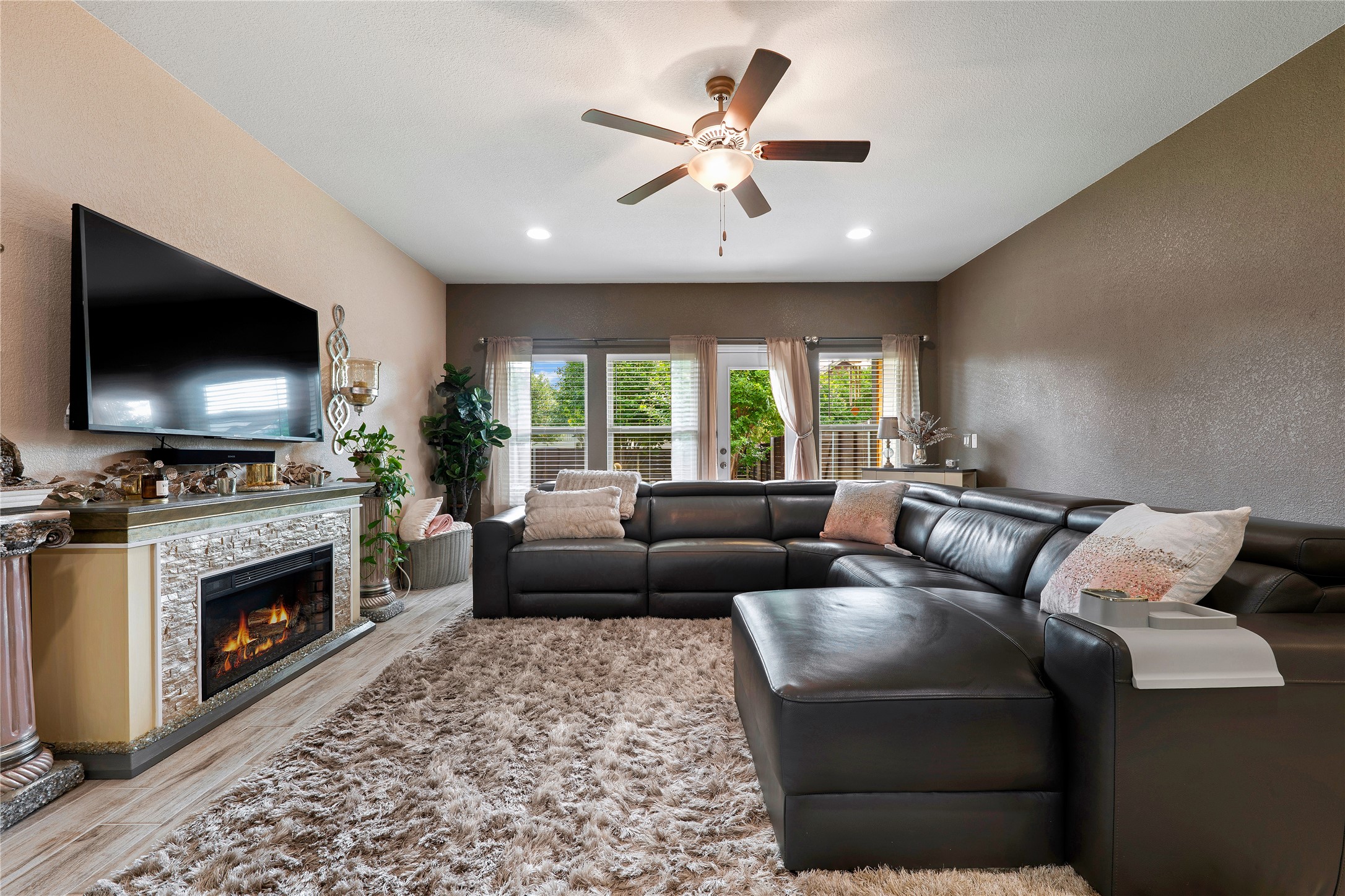 8721 Sikes Way Austin, TX 78747 - Photo 5 of 33 Living area featuring wood-finish flooring, recessed lighting, and a ceiling fan