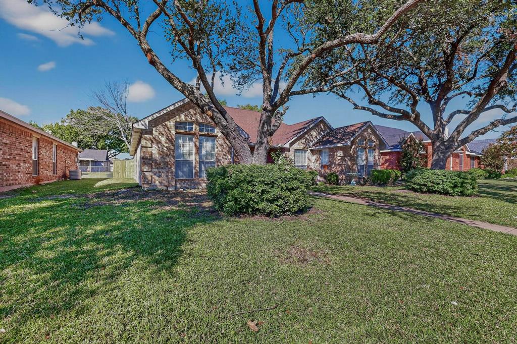 2601 Daisy Lane Rowlett, TX 75089 - Photo 3 of 36 a view of a house with a yard