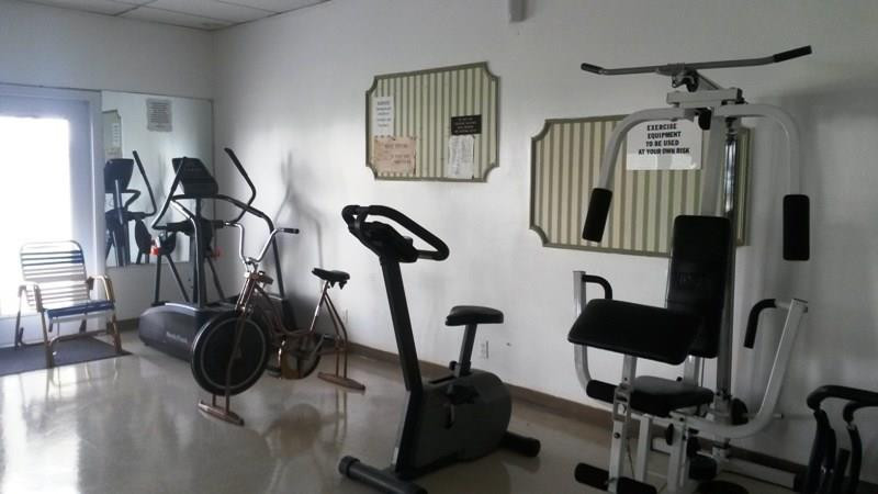 4880 Northwest 22nd Street, Unit 101 Lauderhill, FL 33313 - Photo 5 of 18 a view of a room with gym equipment