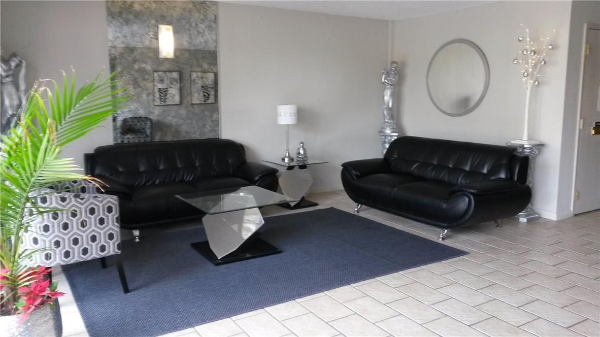 4880 Northwest 22nd Street, Unit 101 Lauderhill, FL 33313 - Photo 9 of 18 a living room with furniture