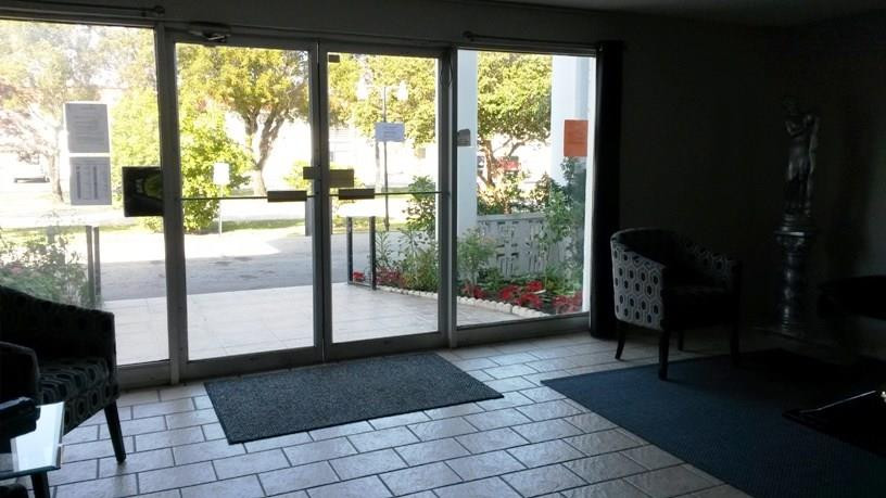 4880 Northwest 22nd Street, Unit 101 Lauderhill, FL 33313 - Photo 10 of 18 a living room with a large window