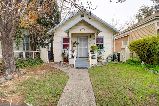 a front view of a house with garden