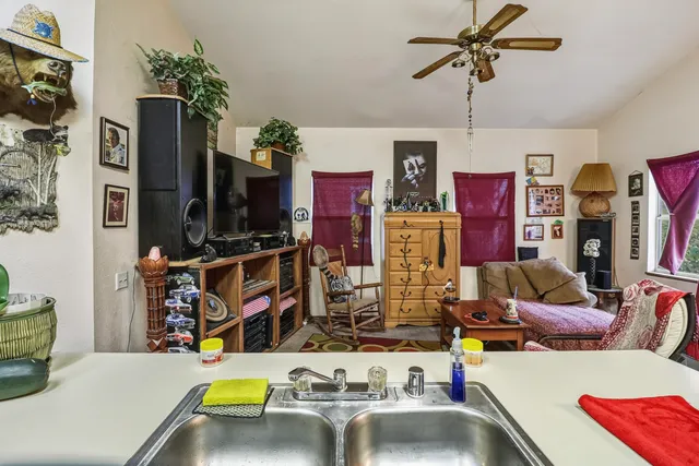 a living room with lots of furniture and a flat screen tv