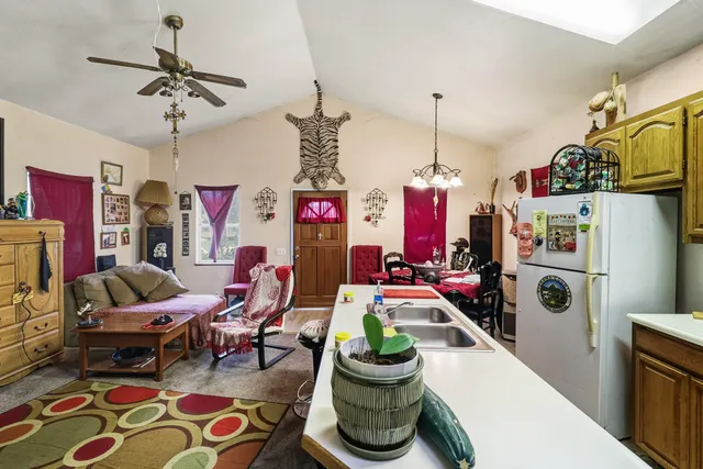 a living room filled with furniture and a chandelier
