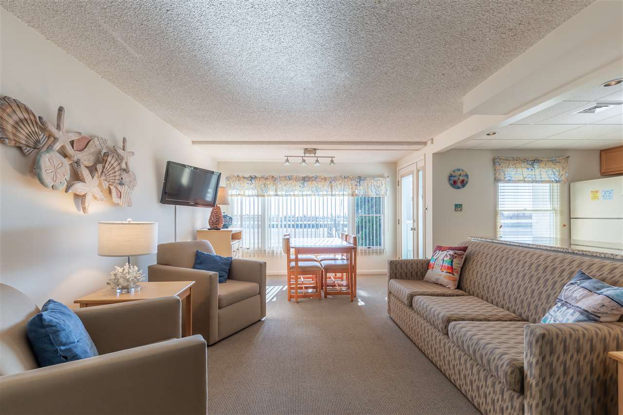 217 Beach, Unit 102 Cape May, NJ 08204 - Photo 8 of 30 a living room with furniture and a large window