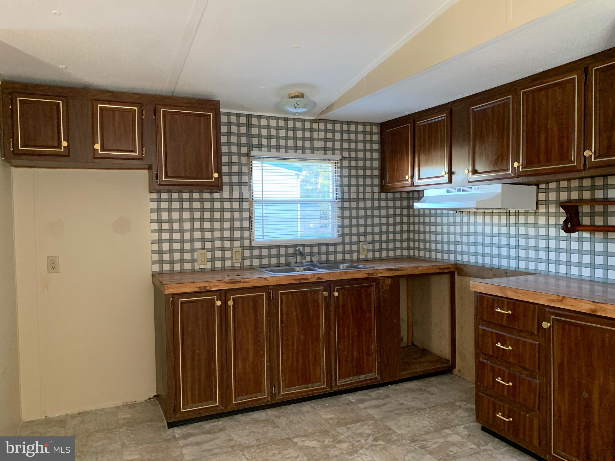 2215 Biglerville Road Gettysburg, PA 17325 - Photo 11 of 41 a kitchen with a sink and cabinets