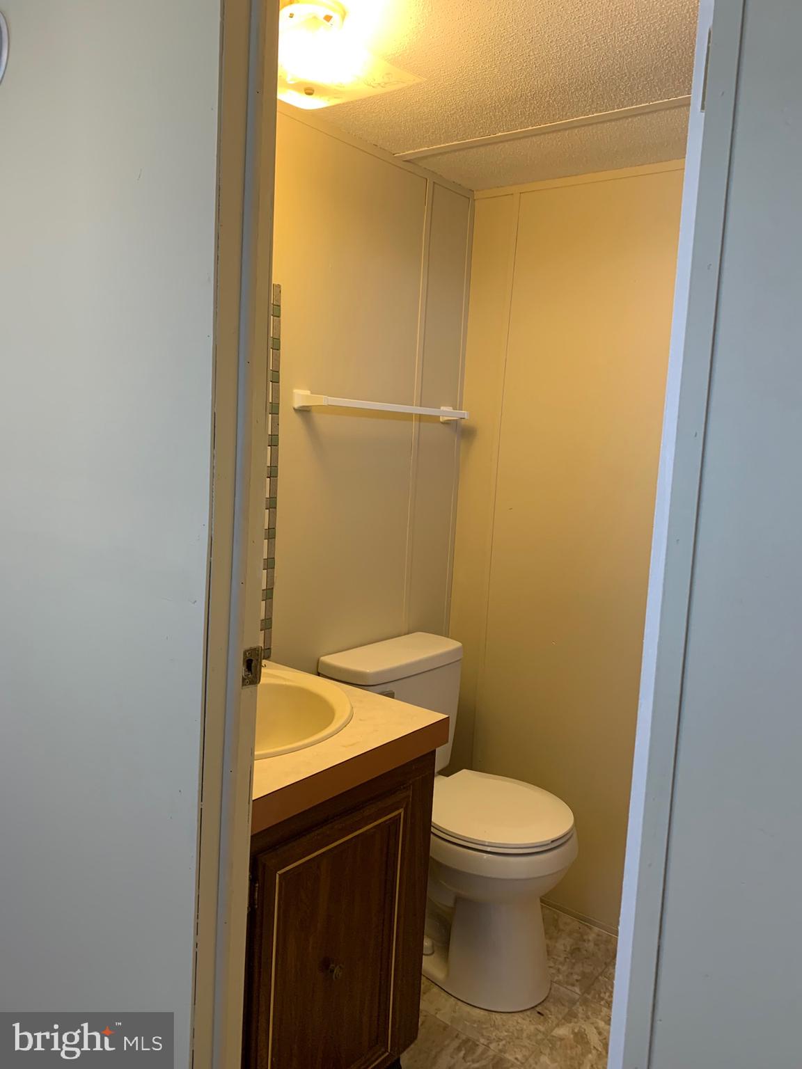 2215 Biglerville Road Gettysburg, PA 17325 - Photo 20 of 41 a bathroom with a granite countertop toilet and a sink