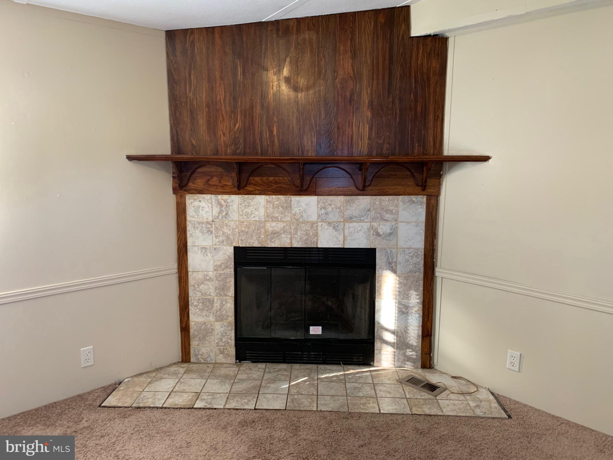 2215 Biglerville Road Gettysburg, PA 17325 - Photo 5 of 41 a living room with a fireplace