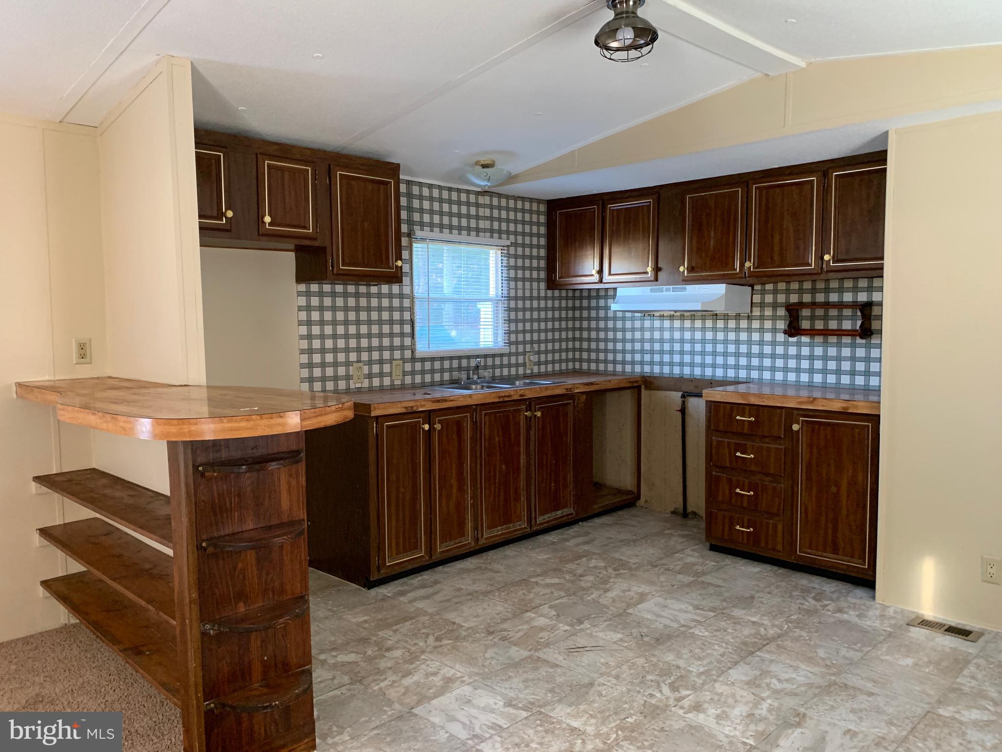 2215 Biglerville Road Gettysburg, PA 17325 - Photo 10 of 41 a kitchen with a sink and cabinets