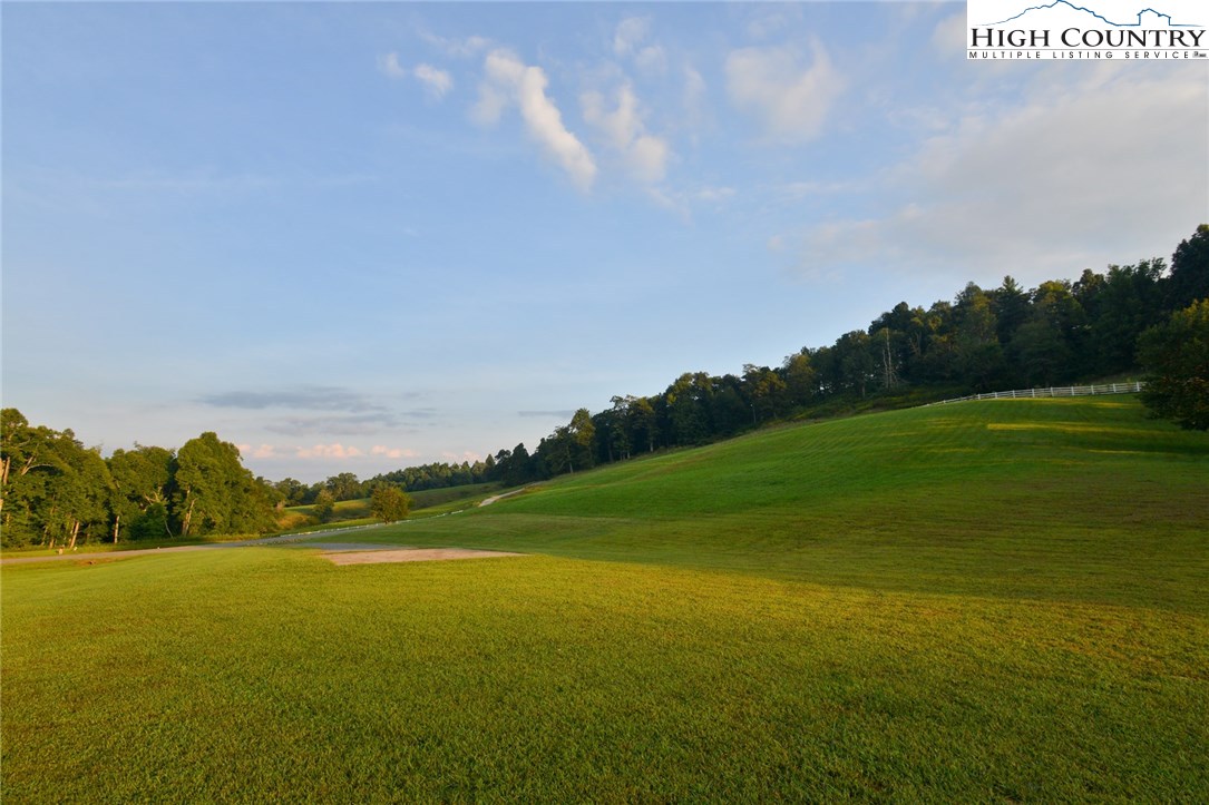 81 Adkins Farm Road Spruce Pine, NC 28777 - Photo 24 of 37 a view of an ocean and a houses