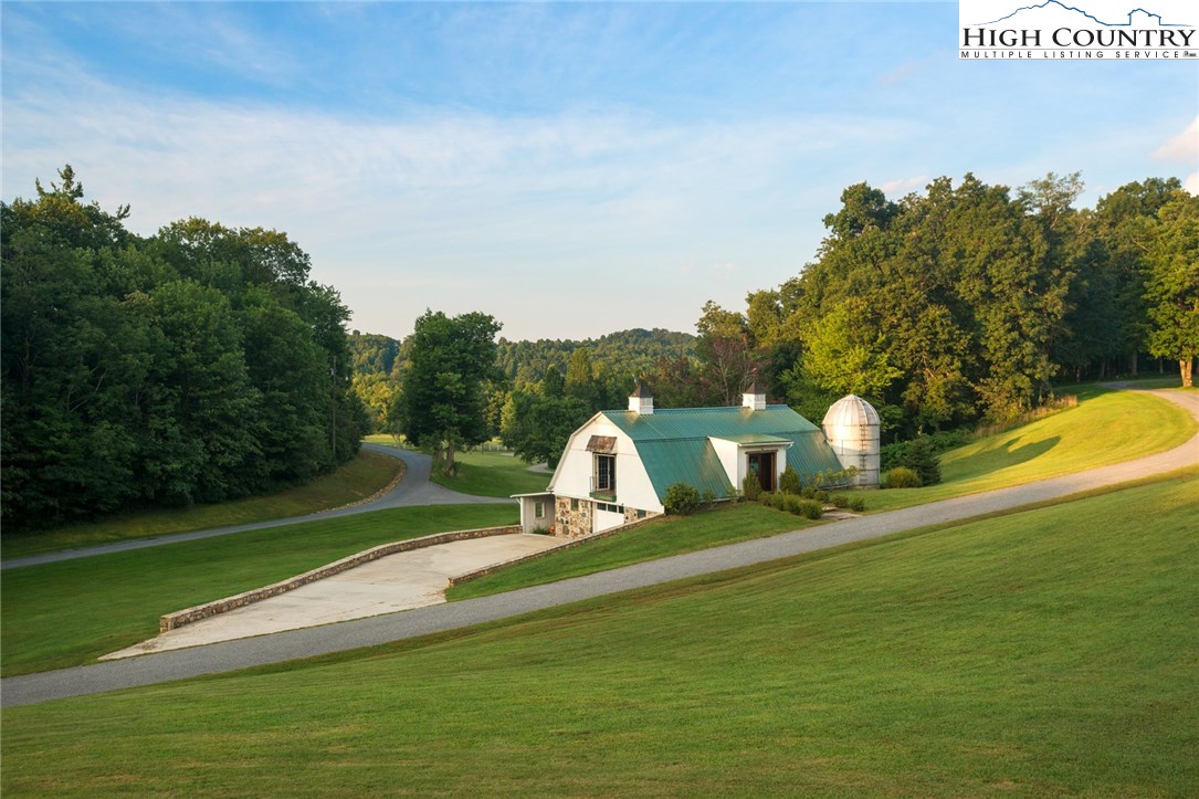 81 Adkins Farm Road Spruce Pine, NC 28777 - Photo 25 of 37 a view of a golf course with a park
