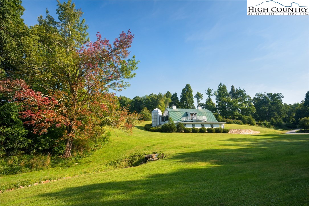 81 Adkins Farm Road Spruce Pine, NC 28777 - Photo 31 of 37 a view of a house with yard and swimming pool