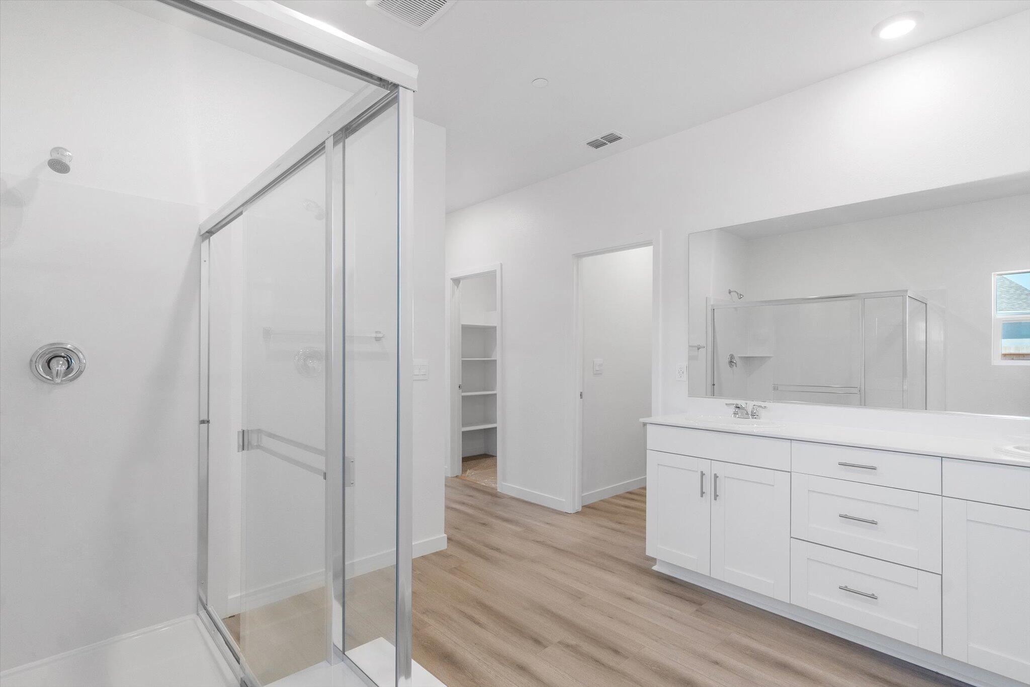 5555 Feathers Avenue Redding, CA 96002 - Photo 15 of 31 a bathroom with a sink and a mirror