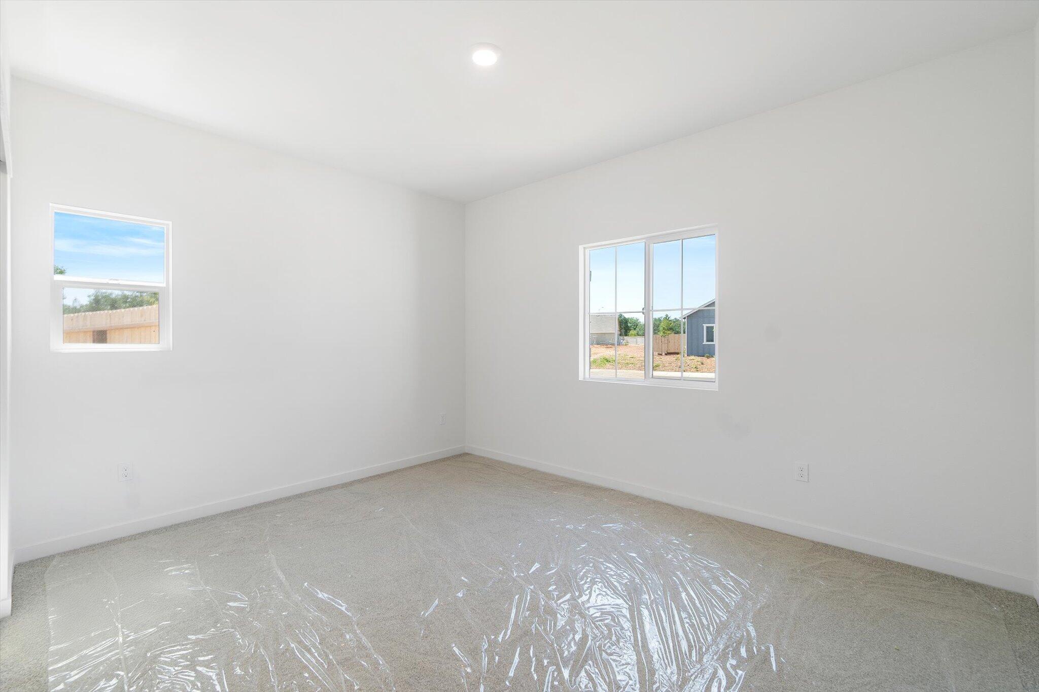 5555 Feathers Avenue Redding, CA 96002 - Photo 19 of 31 an empty room with windows