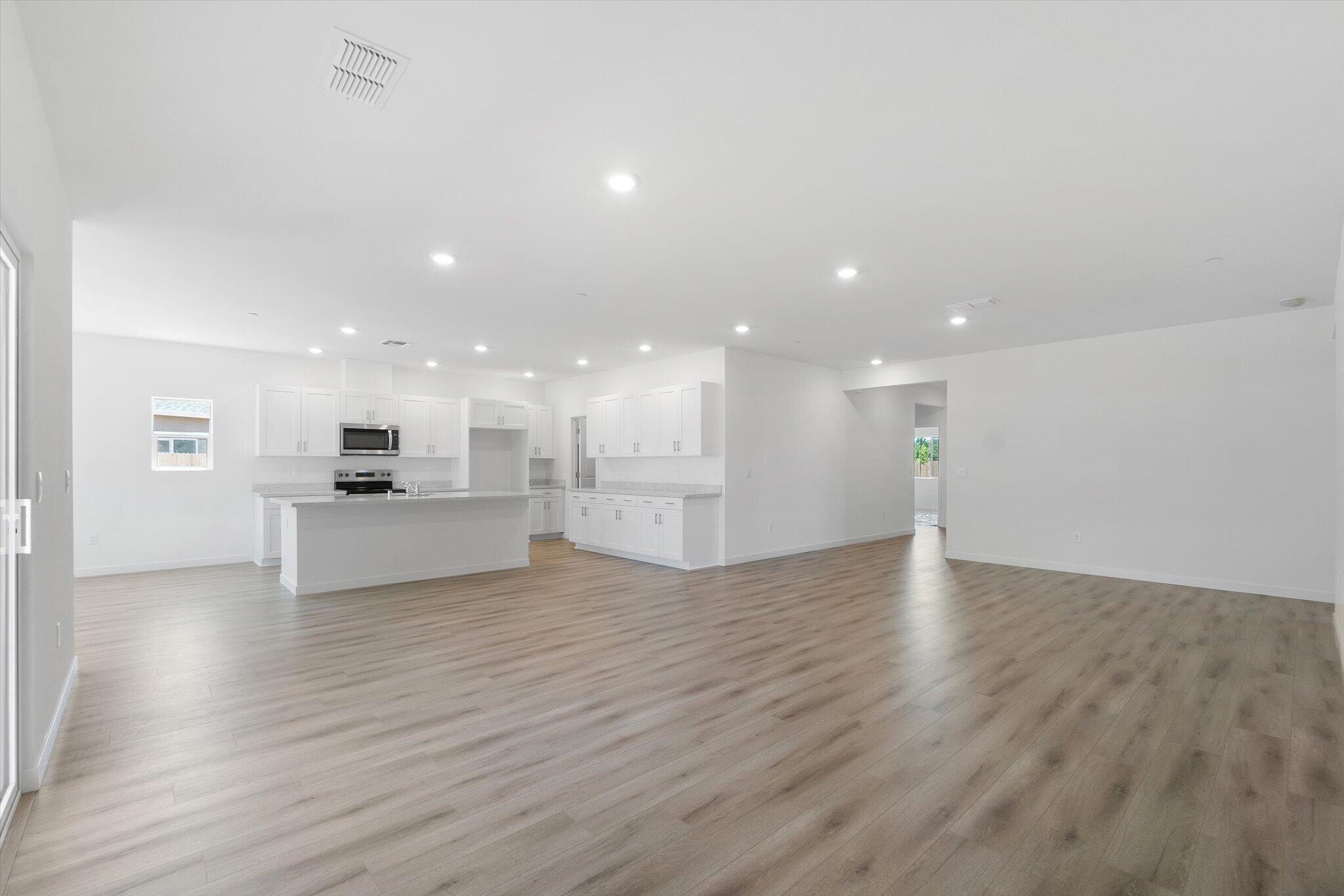5555 Feathers Avenue Redding, CA 96002 - Photo 2 of 31 a view of kitchen with kitchen island sink and refrigerator