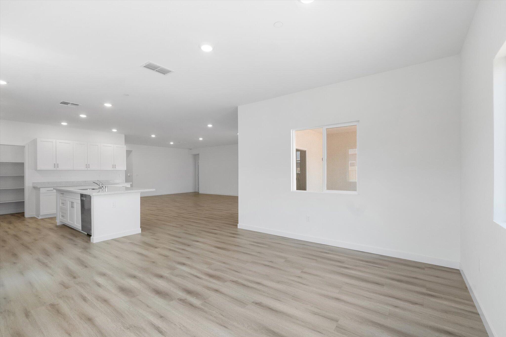 5555 Feathers Avenue Redding, CA 96002 - Photo 9 of 31 a view of kitchen and hall with wooden floor