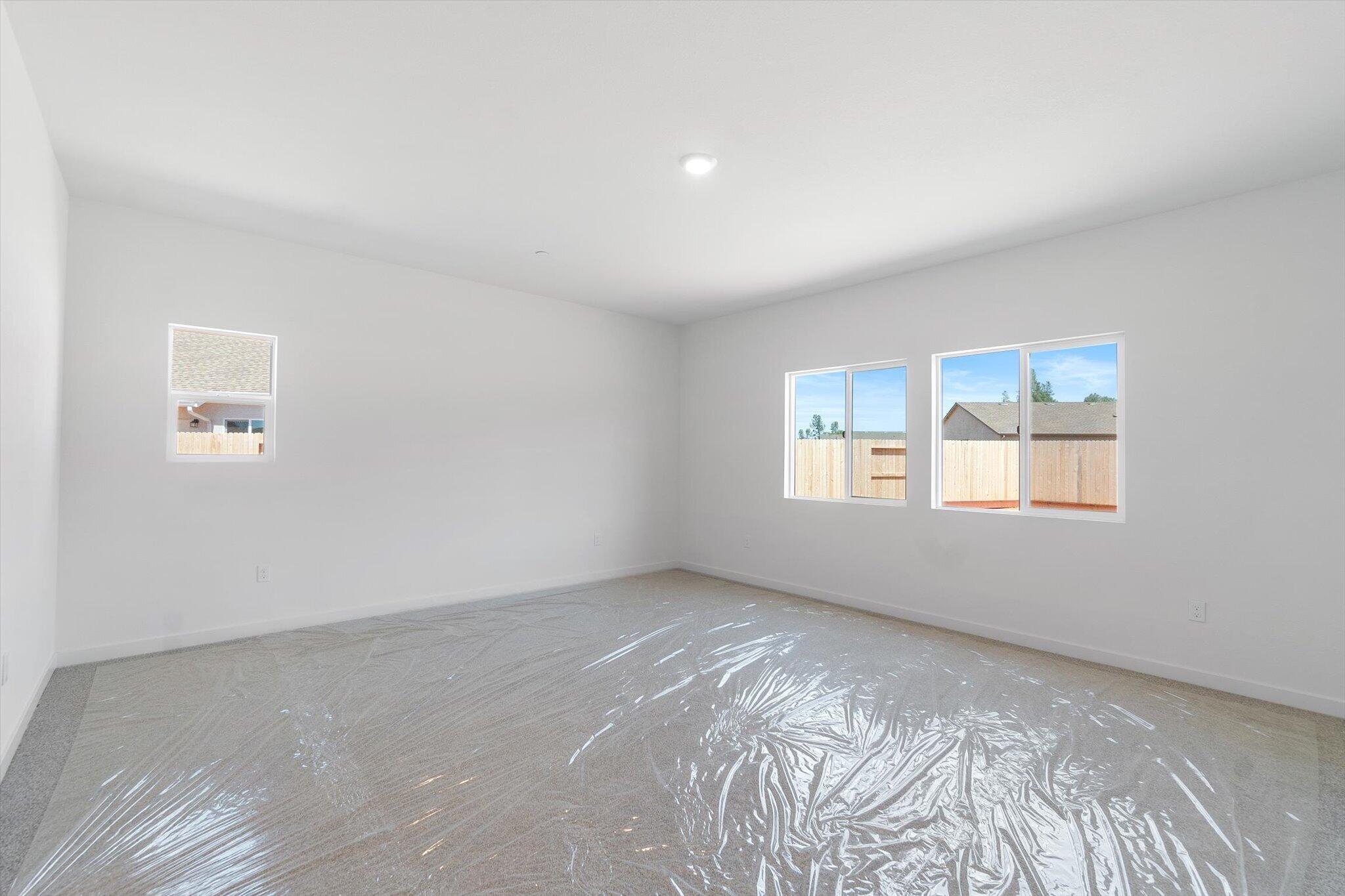 5555 Feathers Avenue Redding, CA 96002 - Photo 10 of 31 an empty room with windows