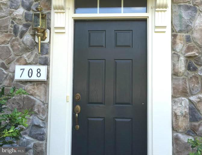 708 Redgate Lane Woodbridge, VA 22191 - Photo 2 of 20 a view of a door and brick wall