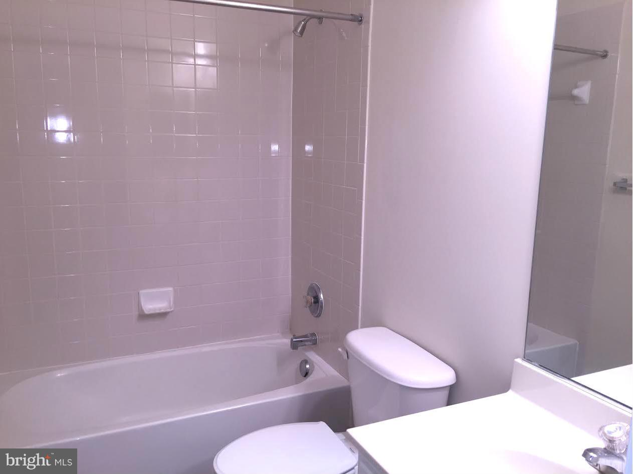 708 Redgate Lane Woodbridge, VA 22191 - Photo 17 of 20 a white toilet sitting next to a bath tub