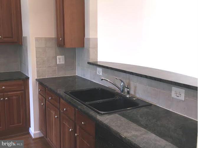 708 Redgate Lane Woodbridge, VA 22191 - Photo 9 of 20 a kitchen with a sink and cabinets