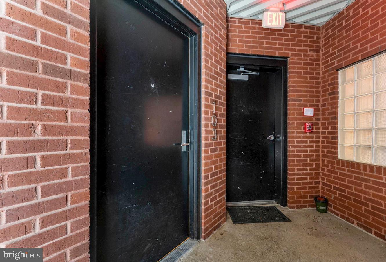 2426 Ontario Road Northwest, Unit 103 Washington, DC 20009 - Photo 22 of 33 Entrance to Unit (Left) & Parking Access on Right