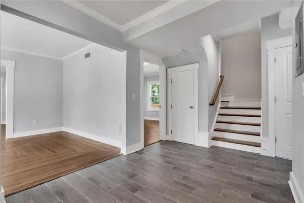 a view of entryway with wooden floor