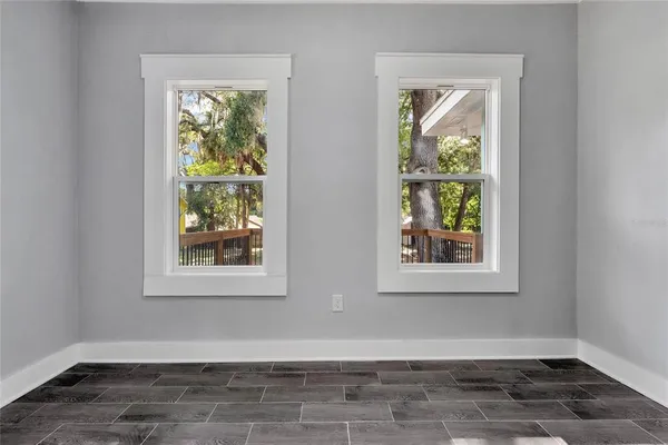 a view of an empty room with a window