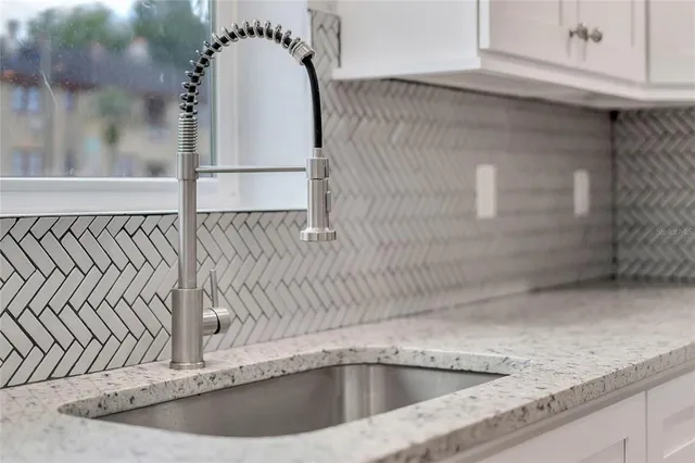 a view of a sink and faucet in a kitchen