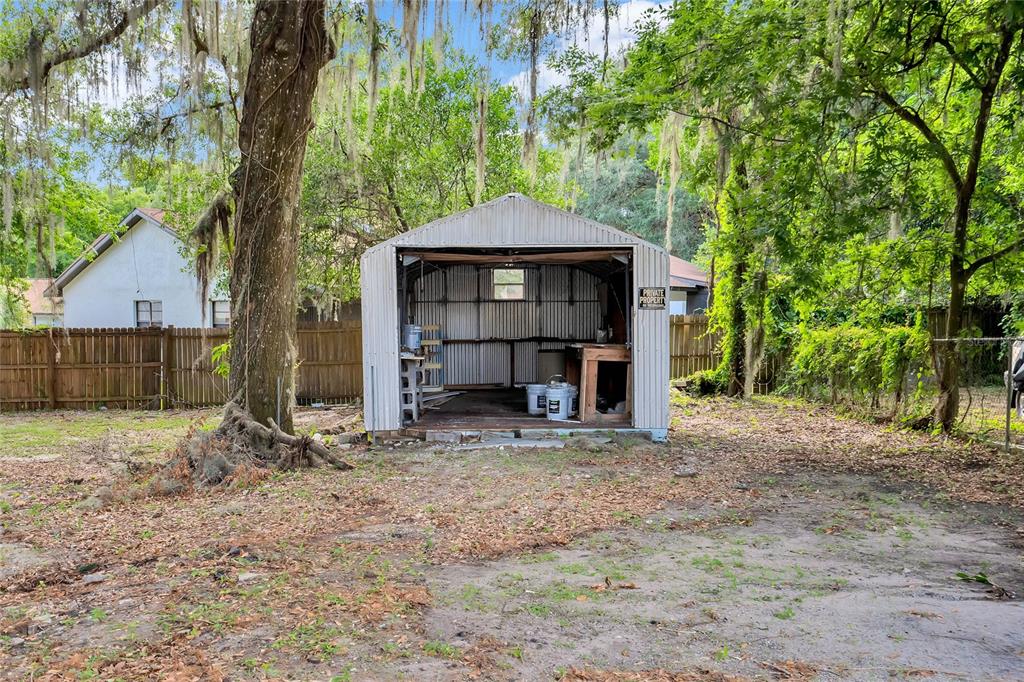 415 South 9th Street Leesburg, FL 34748 - Photo 33 of 37 a view of a barn in the middle of a yard
