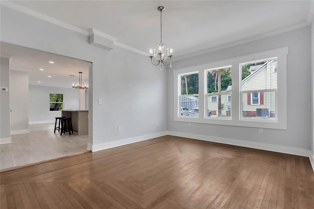 415 South 9th Street Leesburg, FL 34748 - Photo 8 of 37 wooden floor in an empty room with a window